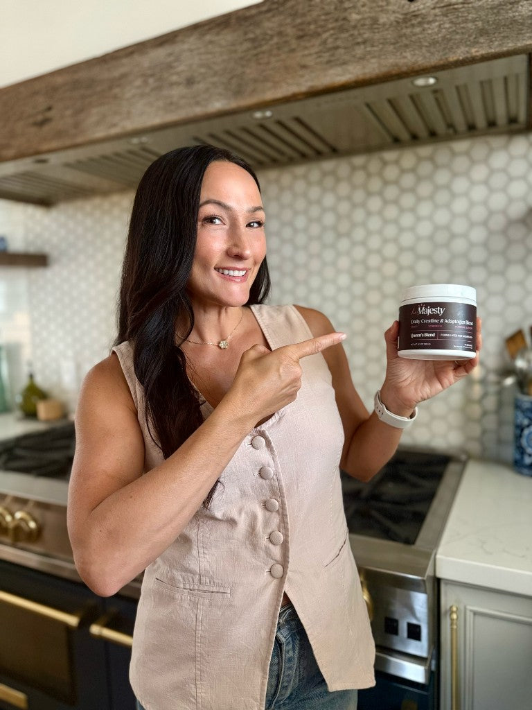 Samantha Prestenbach holding Queen&rsquo;s Blend in her kitchen